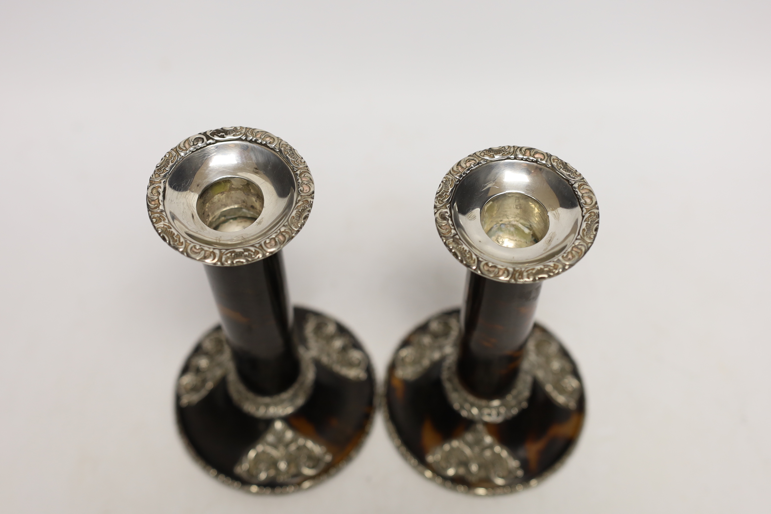 A pair of Edwardian pieced silver mounted tortoiseshell candlesticks, J. Batson & Son, London, 1902, height 16.4cm.